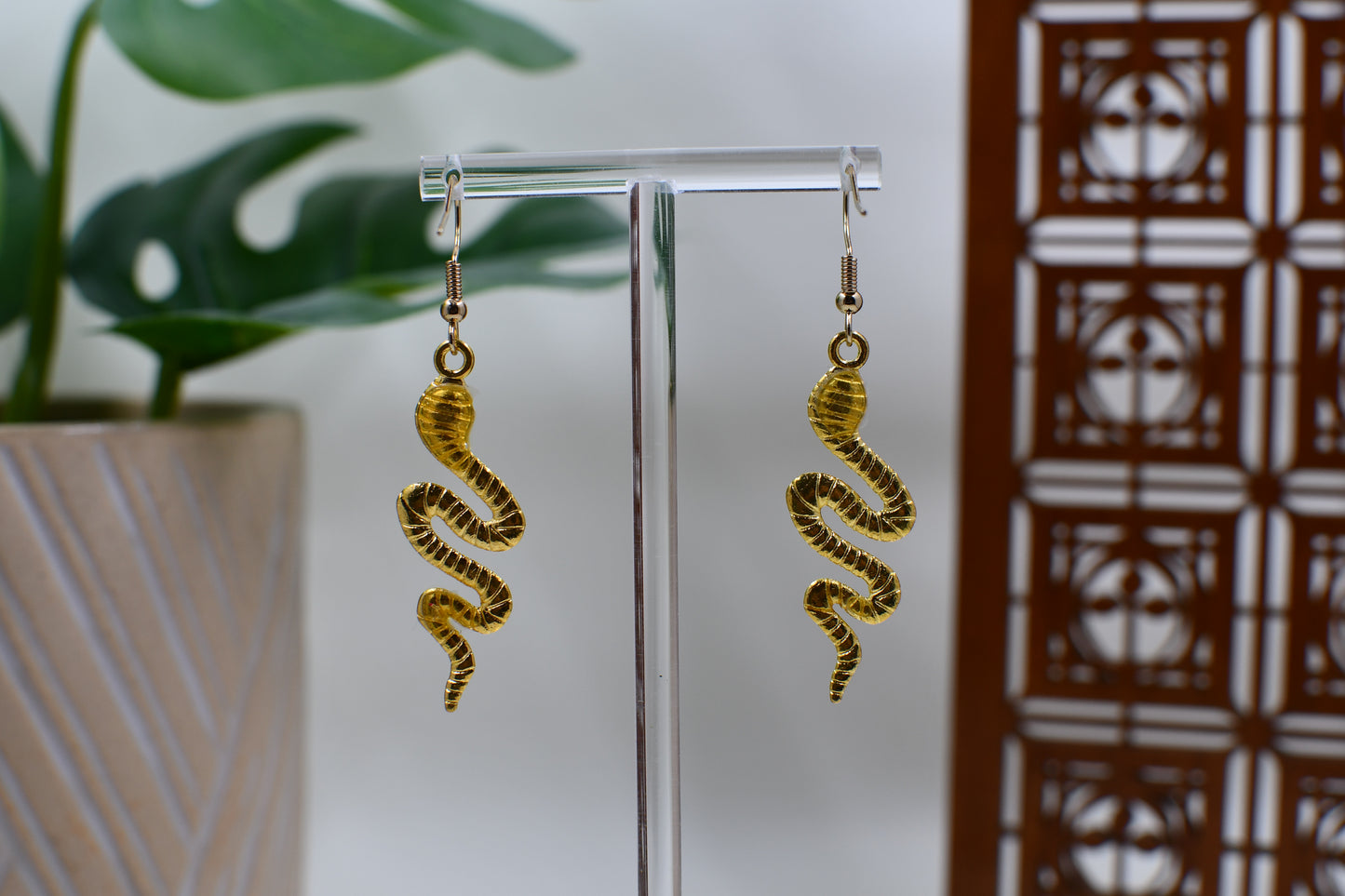 Black Era Gold Snake Dangle Earrings