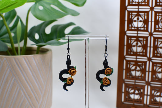 Black Era Snakes with Gold Roses Dangle Earrings
