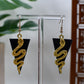 Black Era Gold Snake with Black Triangle Background Dangle Earrings
