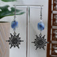 Silver Rhinestone Snowflake with Blue Glass Bead Dangle Earrings